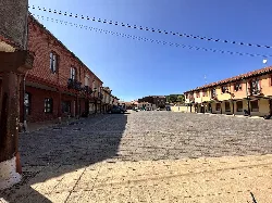 Square with traditional buildings and dovecote in Mansilla de las Mulas.