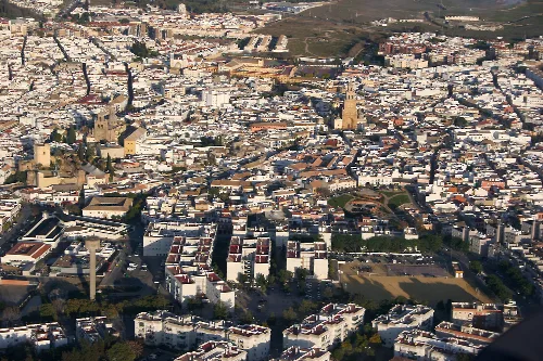 Aerial view of Utrera with churches and historic buildings in the center.