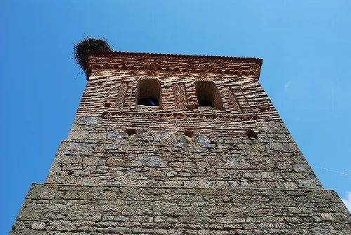 Stone tower with arched windows in Villasila de Valdavia.
