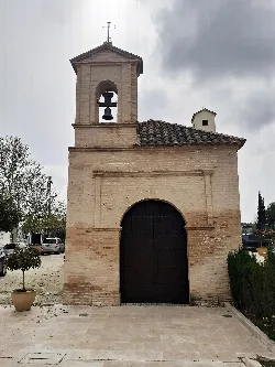 Small chapel with bell tower and cross in Bujalance, Córdoba.