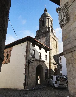View of San Millan Church with bell tower and clock in Leintz.