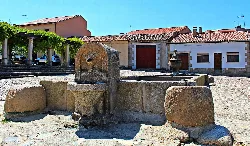 Stone fountain in the square of San Felices de los Gallegos.
