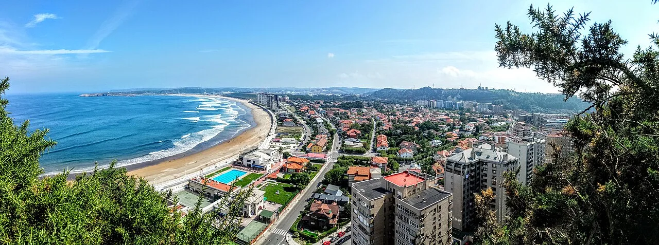 Aerial view of Salinas beach and the town in Castrillón.