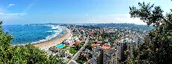 Aerial view of Salinas beach and the town in Castrillón.