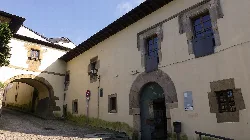 Building with arch and wooden windows in Valdés, Asturias.
