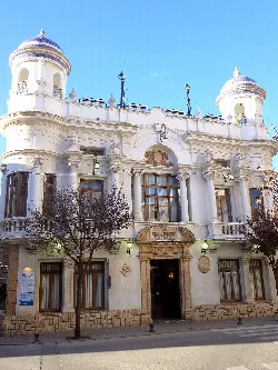 White facade with towers and large windows in Villarrobledo.