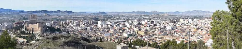 Panoramic view of Villena with city and mountains in the background.
