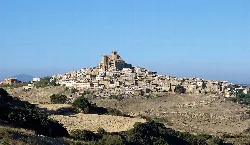 Panoramic view of Ujué with houses and church on the hill.