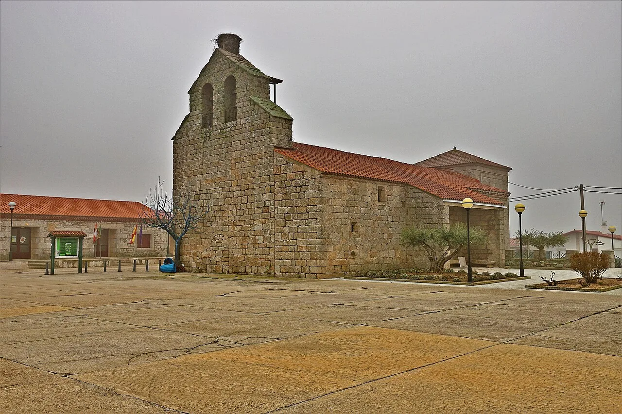 San Miguel Church in Moralina with stone structure and red tiled roof.
