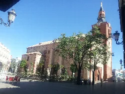 Iglesia de la Inmaculada Concepción en Herencia con torre y fachadas.