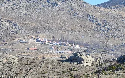Mountain landscape with a small village in the valley.