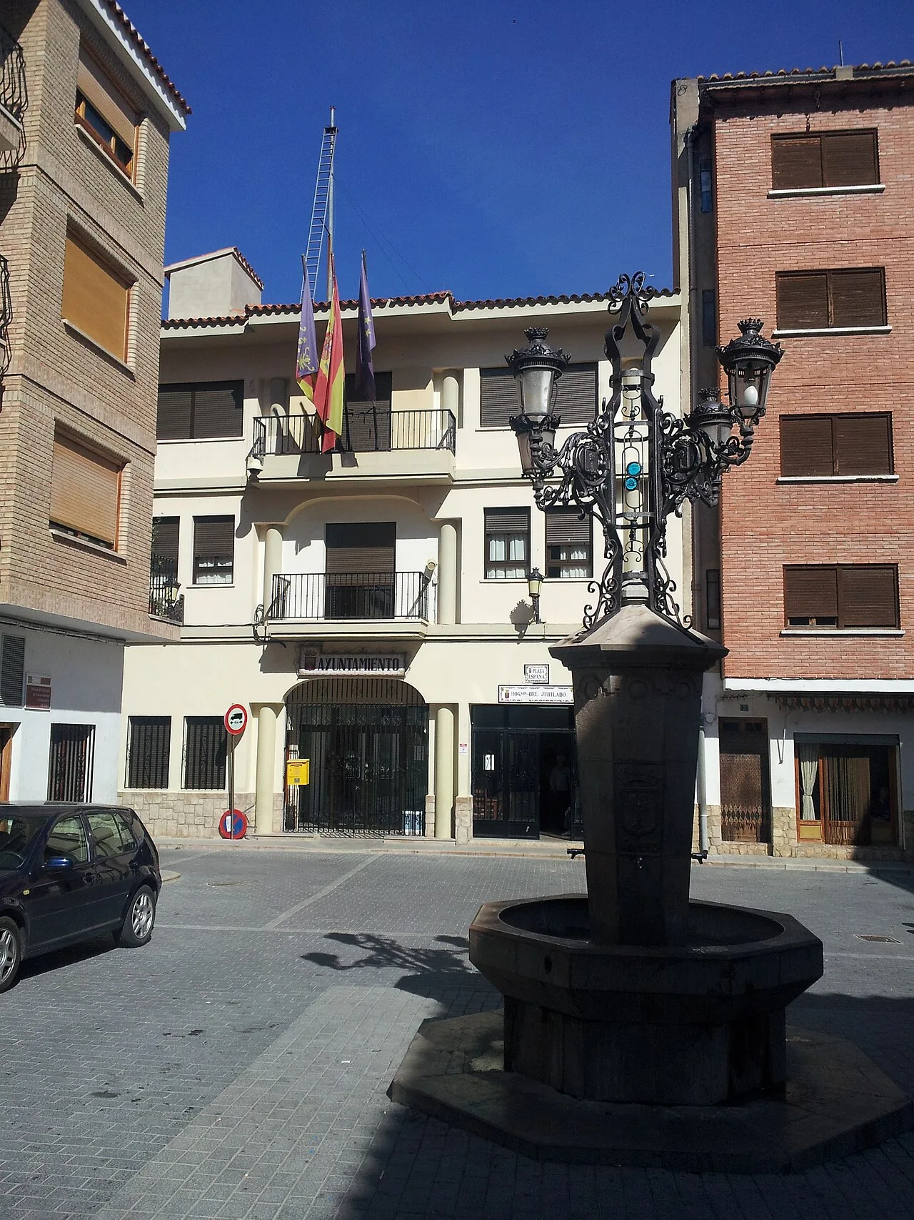 Montanejos town hall building with an old lamp post in the foreground.