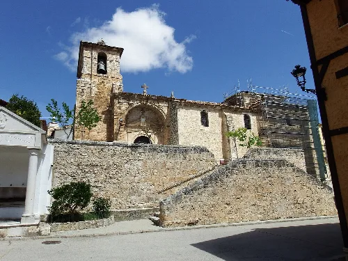 Church of the Assumption in Baños de Valdearados with stairs and scaffolding.