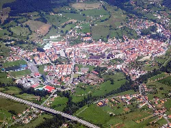 Aerial view of Grado, Asturias, with streets and buildings.