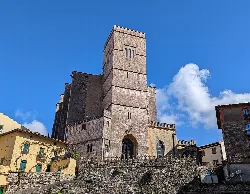 San Pedro Church with tall tower and stone structure in Zumaia.