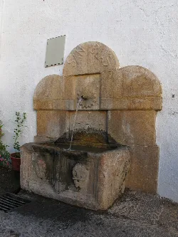 Stone fountain with flowing water in Laujar de Andarax.