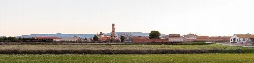 Rural landscape with church and buildings in Lécera, Zaragoza.