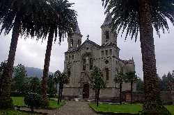 Church of Jesús de Nazareno de Pito with palms and gardens.
