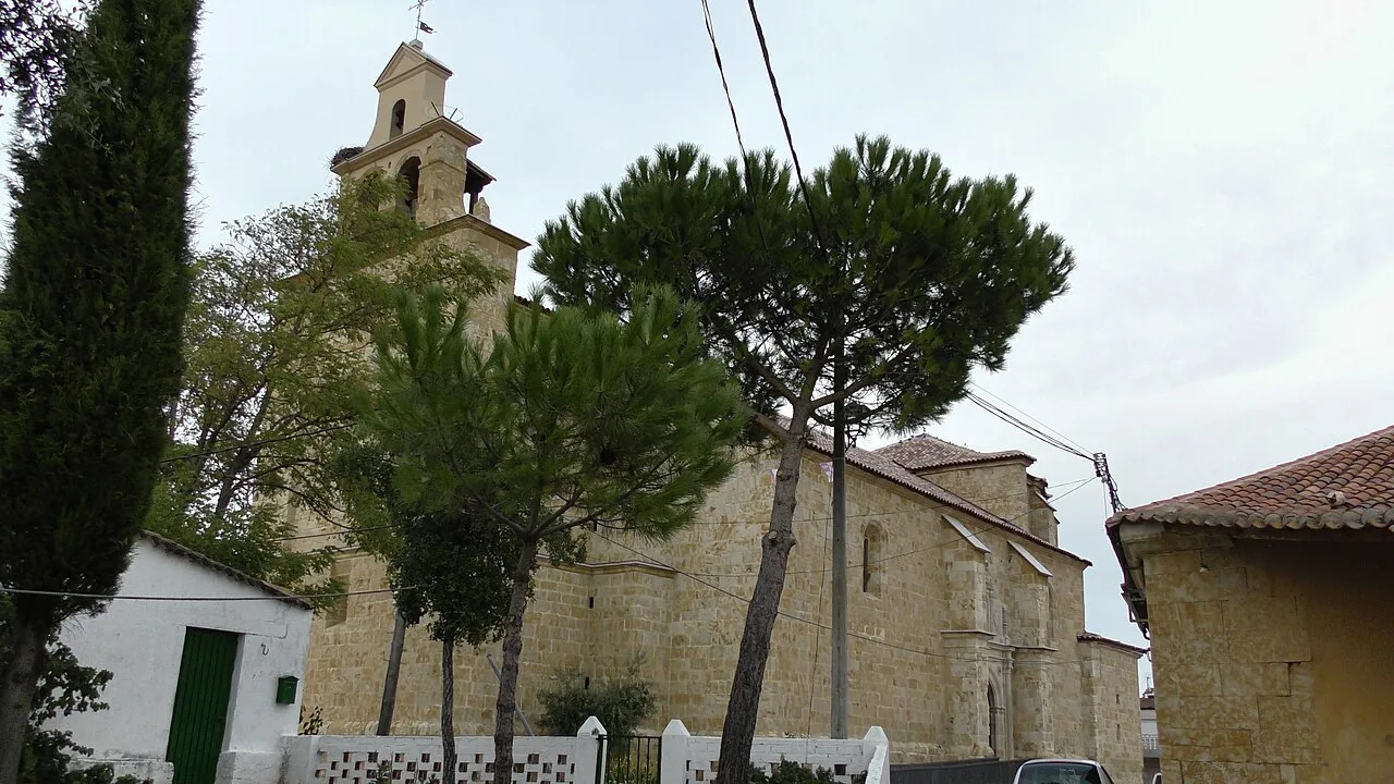 Parish church with trees and tower in Casaseca de las Chanas.