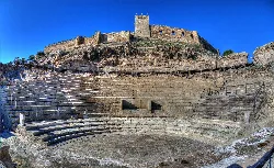 Roman theater in Medellín with seating and stage on the hillside.