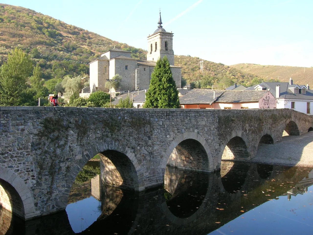 Stone bridge with arches over the Meruelo river in Molinaseca.