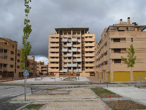 View of Encina Square with buildings and trees in Ciudad Valdeluz.