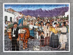 Tile showing farmers, a woman figure, and mountains in the background.