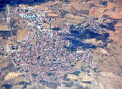 Aerial view of Azuaga with streets and buildings visible.
