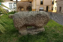 Stone Vetón boar sculpture at Castillo de Bayuela.