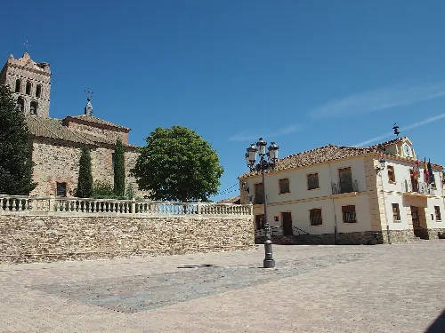 Main square in Migueláñez, Segovia (Spain) called Plaza Mayor. Buildings: the Town Hall on the right and the Nuestra Señora de la Asunción Church.