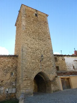 Stone gate with arch and tower in Mosqueruela.