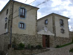 Stone building with white walls in Miou, Asturias.