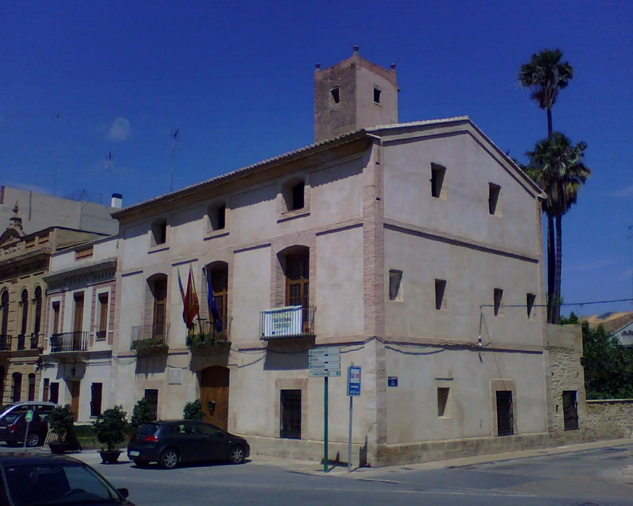 Town hall building with flags and tower in Rocafort.
