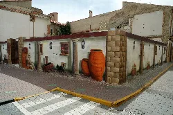 Urban art mural with jars and wall decorations in El Provencio.