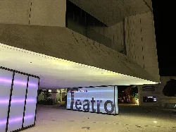 Fachada moderna del teatro Salvador Távora en Almonte con cartel luminoso.