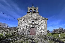 Stone church facade with bell tower in Lagunilla, Salamanca.