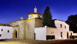 Monastery with dome and white walls in Palos de la Frontera.