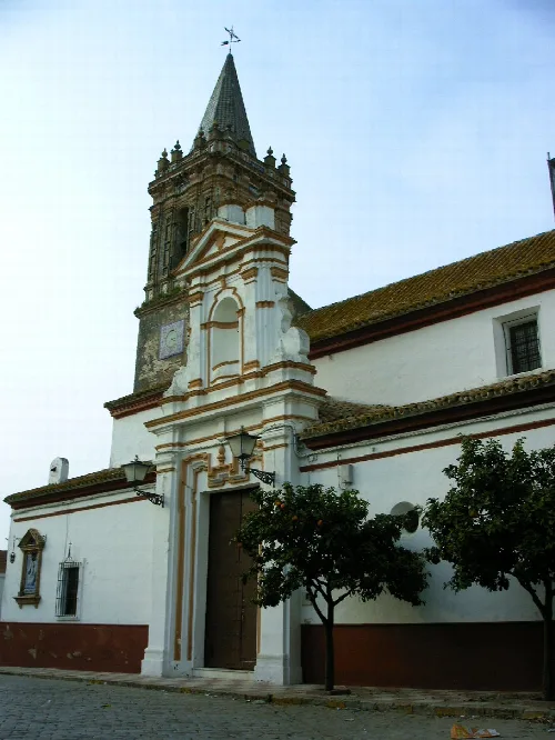 Church with tower and ornate façade in Escacena del Campo.