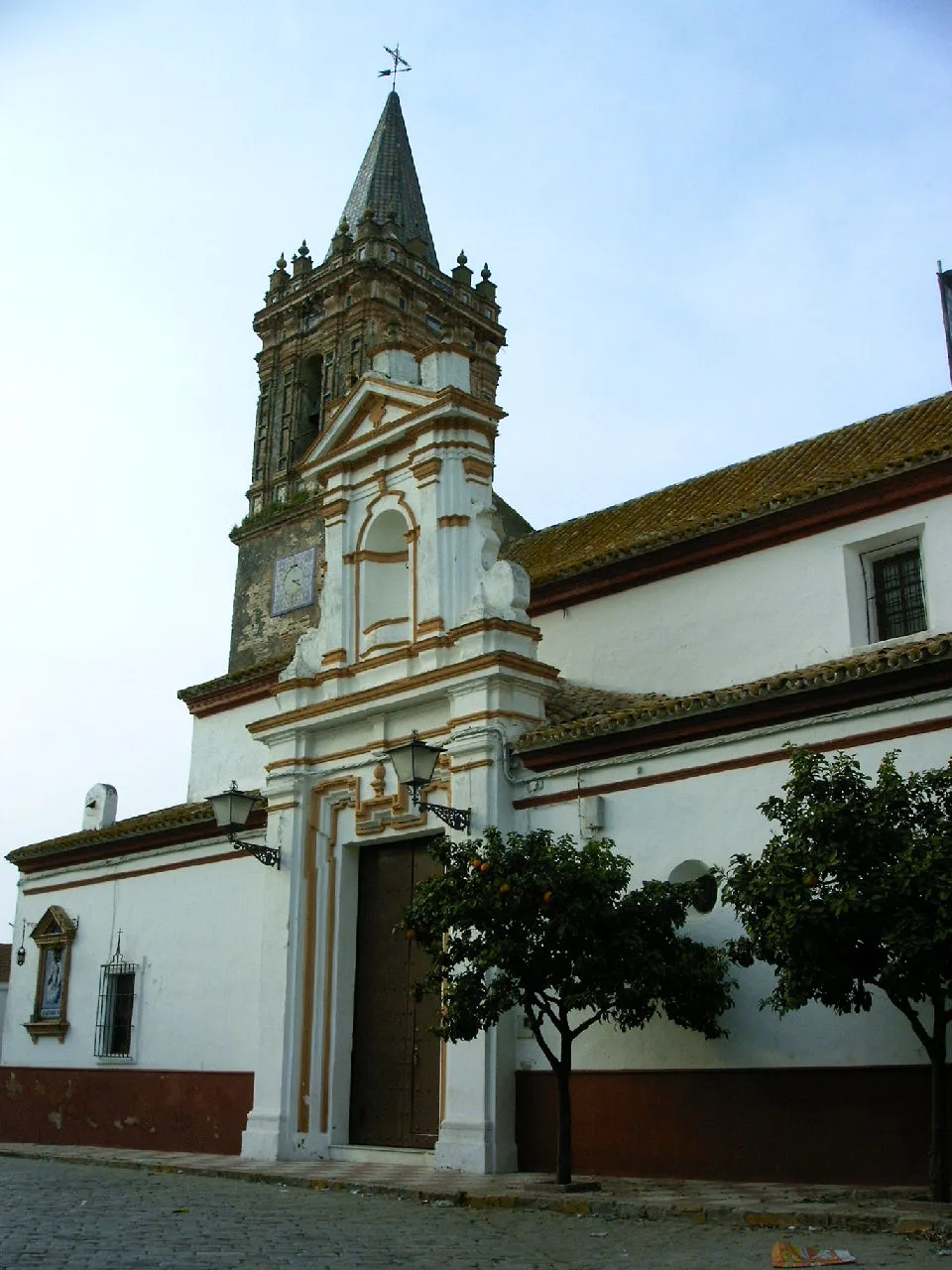 Church with tower and ornate façade in Escacena del Campo.