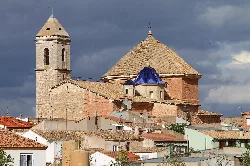 Church of the Nativity with bell tower and tiled roof in Alborea.