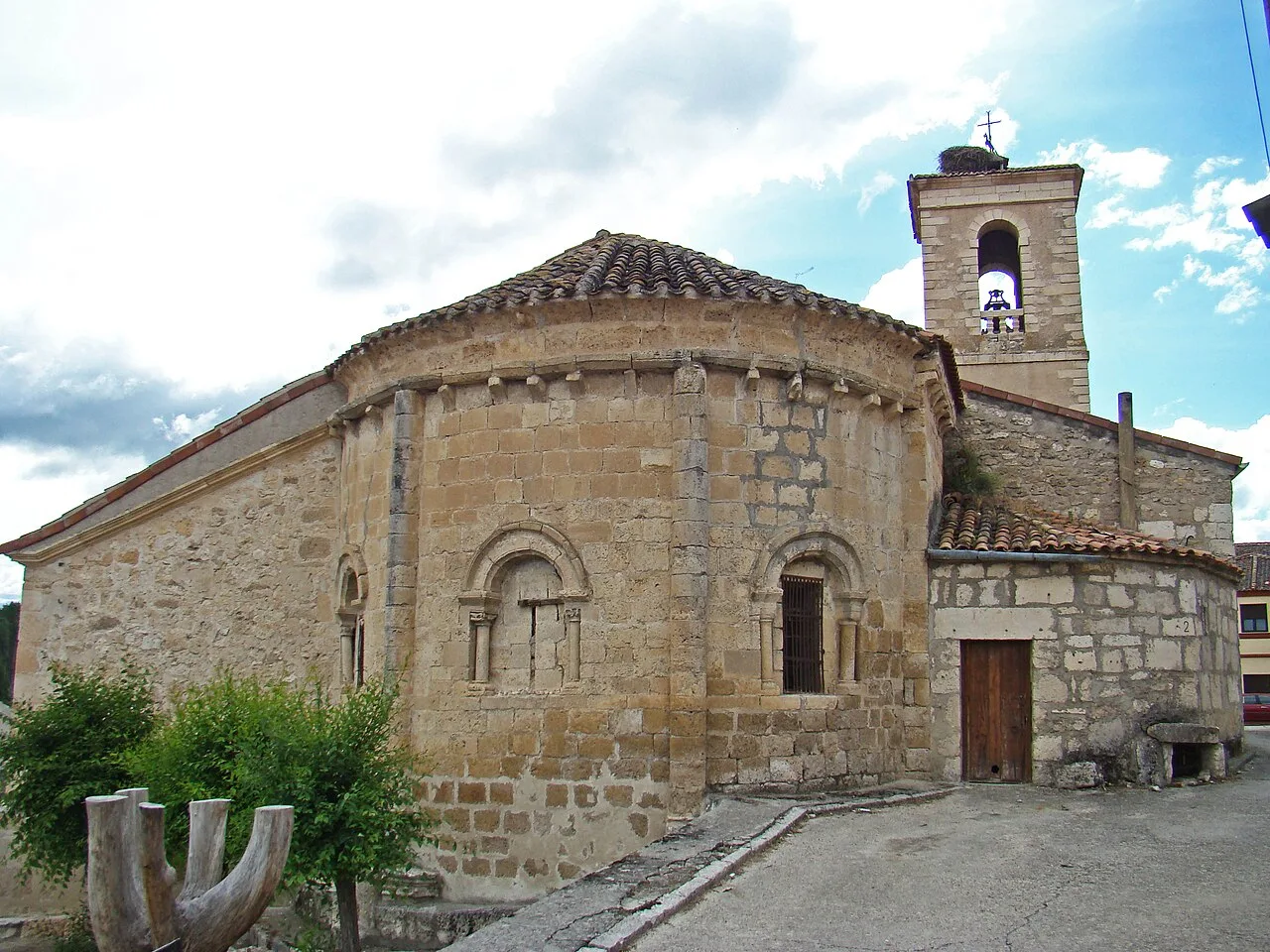 Stone apse and bell tower in Sacramenia.