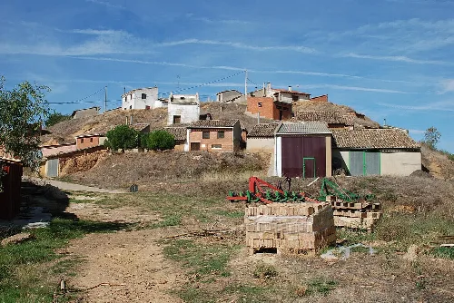 Wine cellars and buildings on a hill in Abia de las Torres.