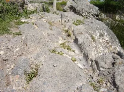 Rocks and remains of an ancient Roman road in Padul, Granada.
