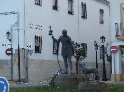Statue of San Roque with his dog at the Cuatro Vientos roundabout.