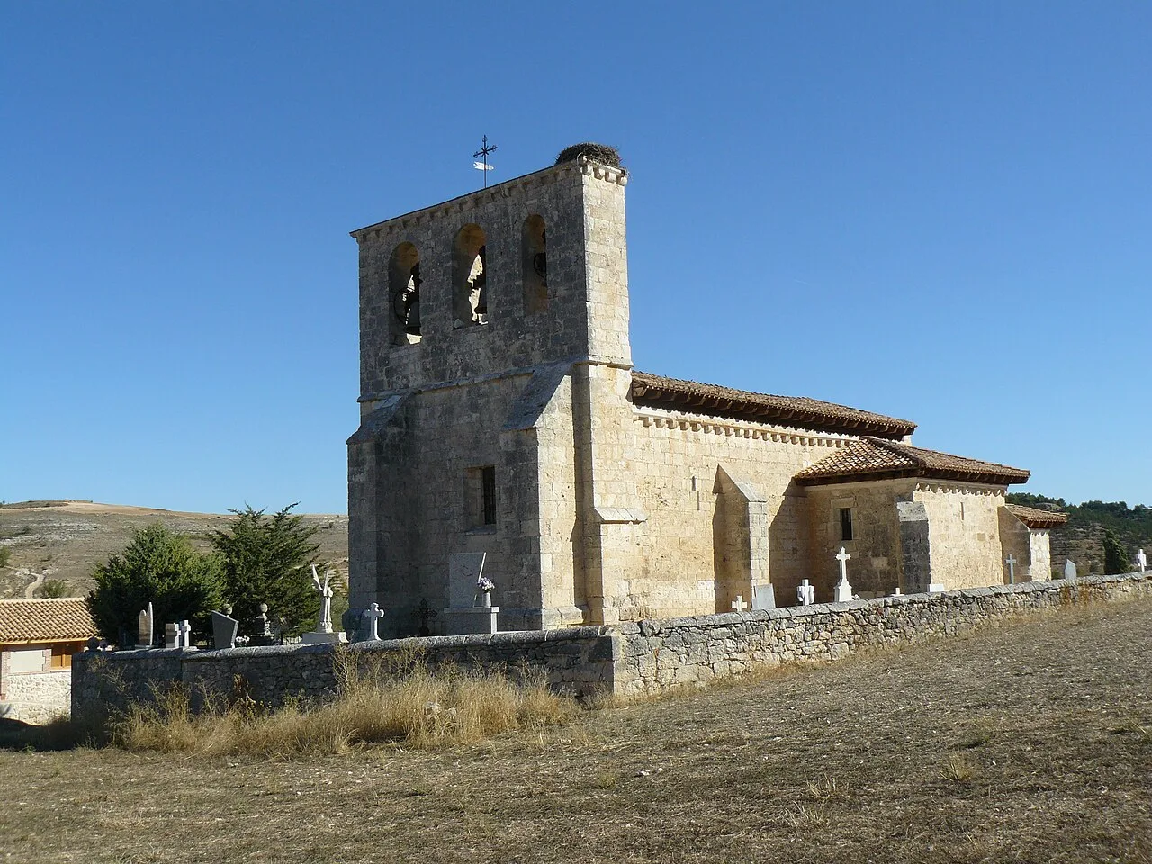 Stone church with bell tower in Villatuelda, Burgos.