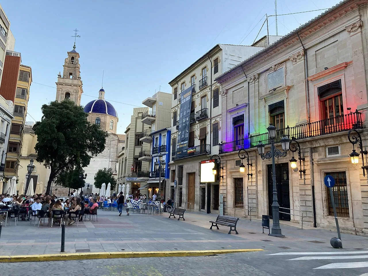Sueca town square with cafes and historic buildings on a summer afternoon.