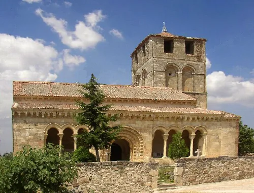 Romanesque church with tower and decorated facade in Sotosalbos, Segovia.