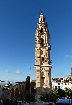 Church tower with multiple levels and decorative details in Estepa.