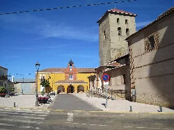 Main square with church and tower in Bercianos del Páramo.
