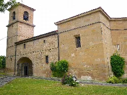 Church of Our Lady of the Assumption in Rivaguda, Álava, with tower and stone facade.